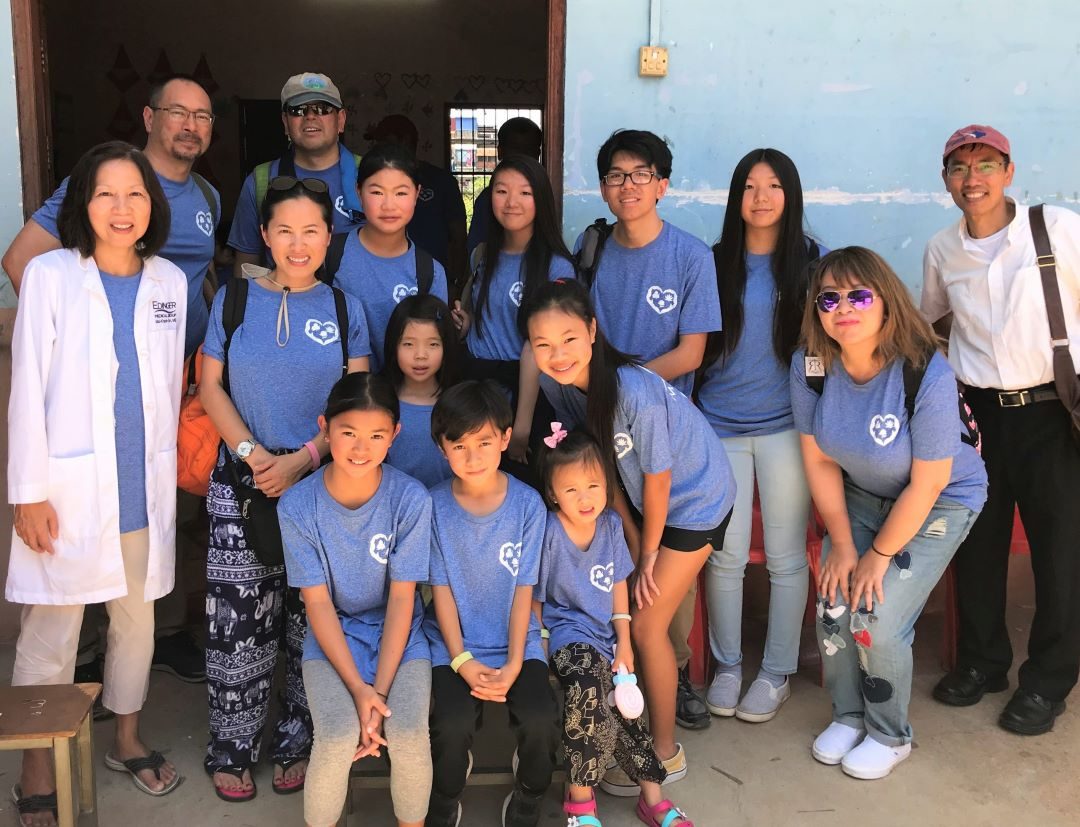 Volunteers and community members gathered in a Tonlé Sap village