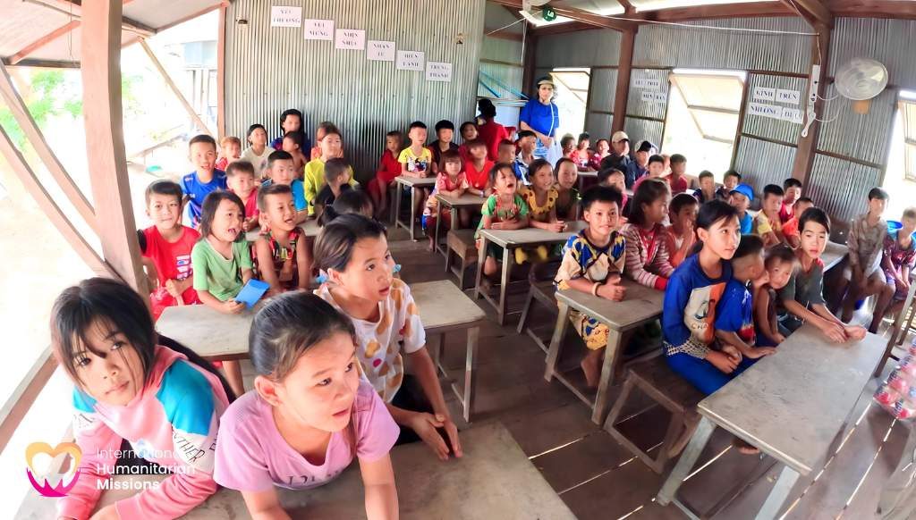 A full classroom of Cambodian children learning in the IHM schoolhouse