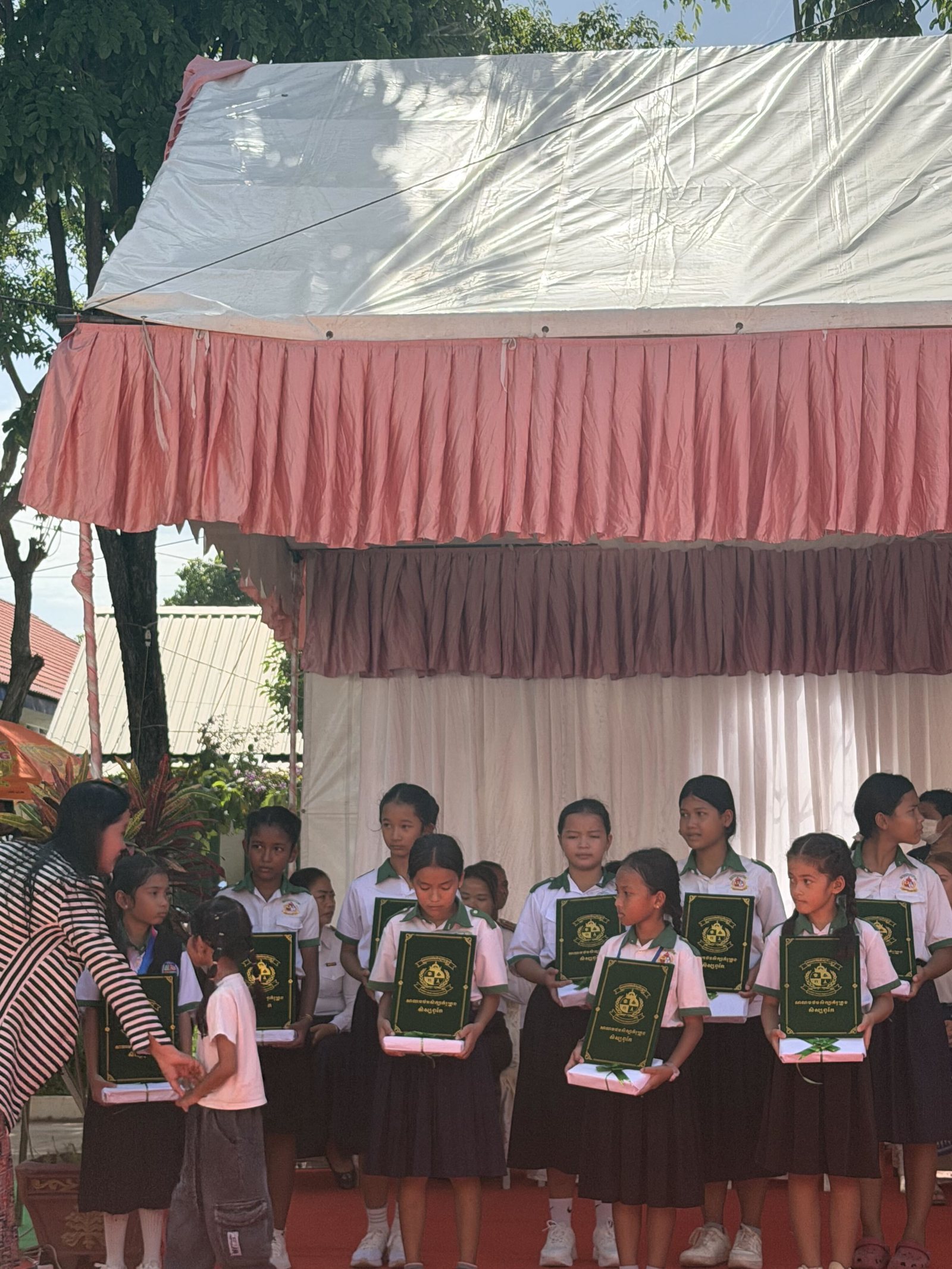 Students receiving academic recognition at the public school awards ceremony