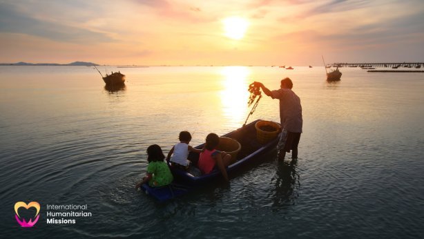 A family fishing at sunset on the Tonle Sap river — children watching from the boat as their parent casts a net
